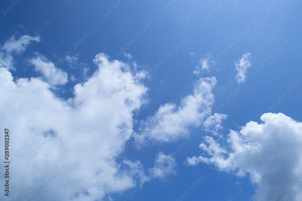 blue sky with clouds and the sun blue sky with clouds and the sun