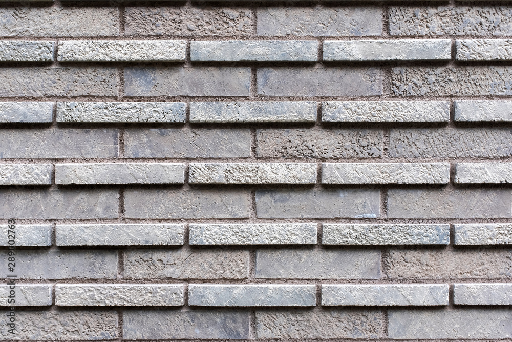 Closed up grey brick wall texture. Architectural material construction. Closed up grey brick wall texture. Architectural material construction.