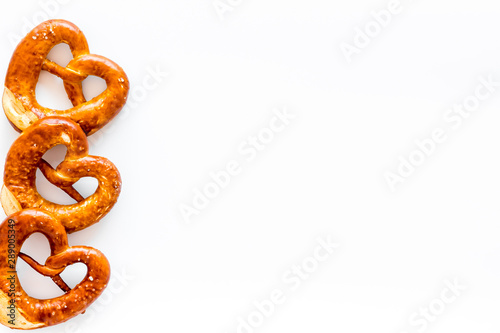 Pretzels frame, white background top view copy space