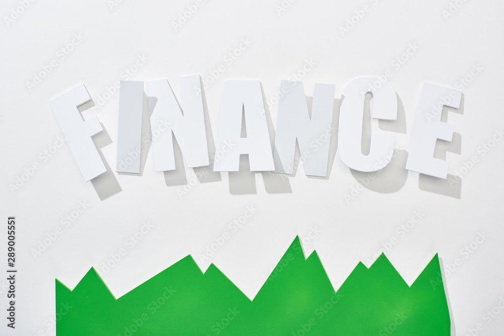 top view of finance inscription with green statistic graph on white background top view of finance inscription with green statistic graph on white background