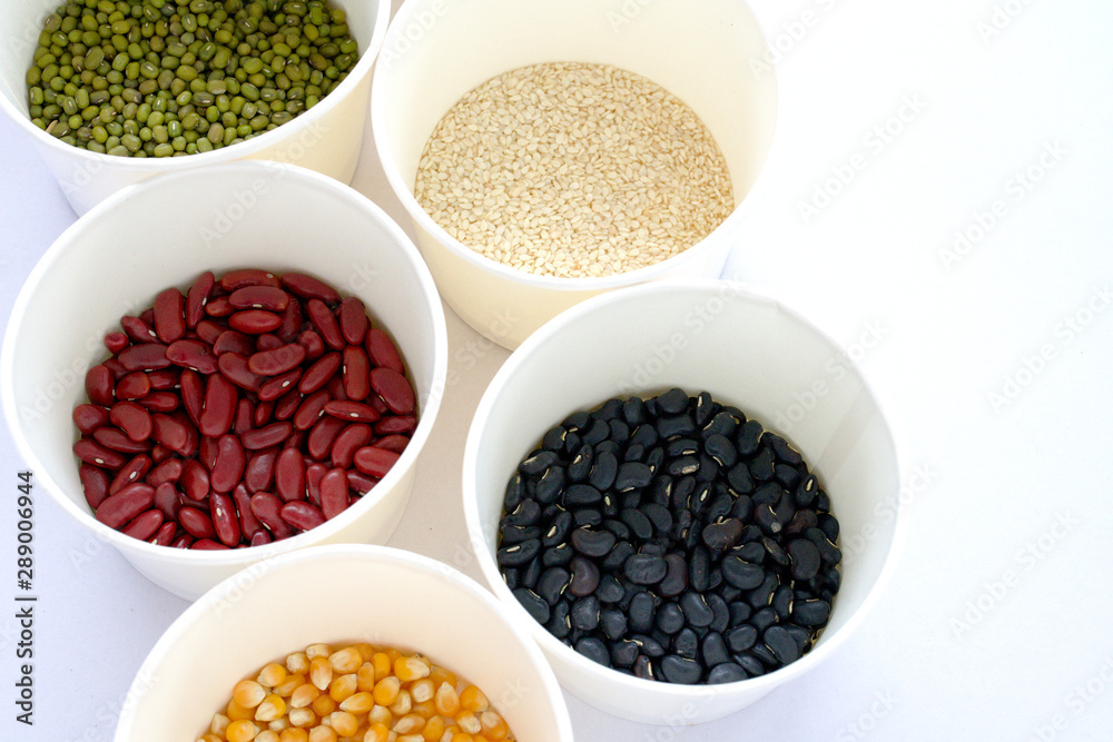 Mixed Beans in a white container on a white background Mixed Beans in a white container on a white background