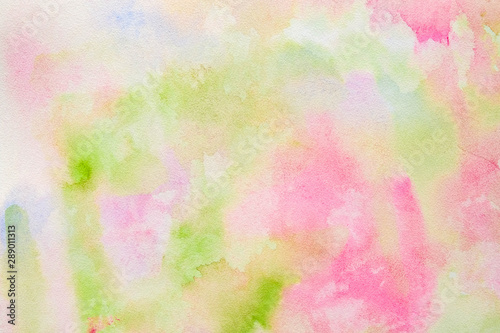 Abstract pink-green watercolor background, bright, contrast splashes, drops, smudges. Artistic background with paper texture.