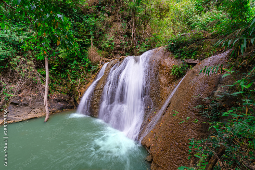 Naklejka premium Waterfall in deep rain forest jungle (Thung Nang Khruan Waterfall) Thailand