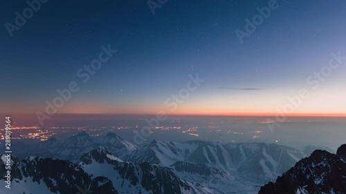 Timelapse is showing a view of the night sky and dawn before sunrise from Lomnicky Peak in April over Tatra Mountains.