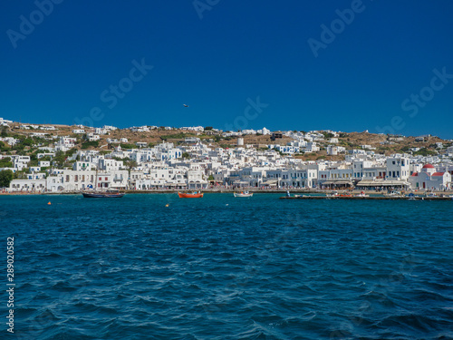 Picturesque seascape with boats and white buildings © Armando