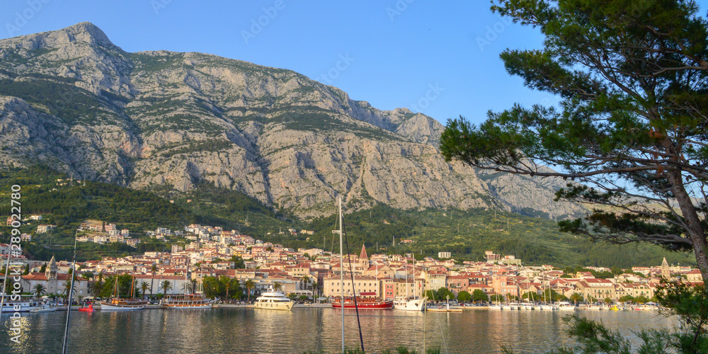 View of Makarska city center from the sea in Makarska,  Dalmatia, Croatia on June 11, 2019. 