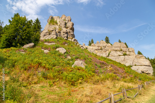 Rocks on the top of the mountain. Hills landscape with picturesque stones on the mountain top. Concept of success in business.