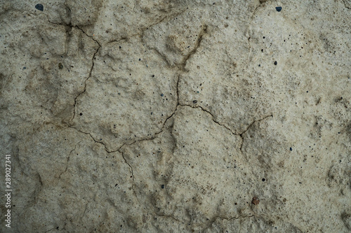 Texture of dried cracked clay. Macro background image of dried clay