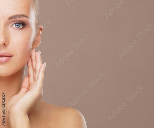 Beauty portrait of healthy and attractive woman. Human face in a concept of spa, skin care, cosmetics, make-up, complexion and face lifting. photo
