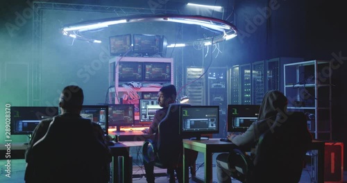 Young men hacking in a basement