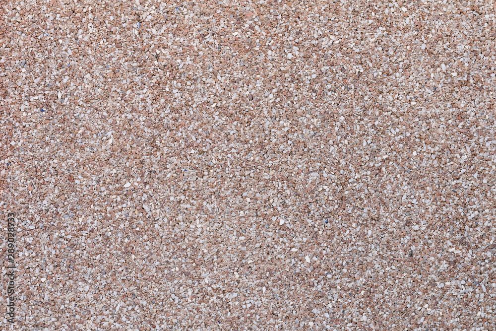 Textured wall made of small colored stones. Abstract rough grunge modern background Textured wall made of small colored stones. Abstract rough grunge modern background