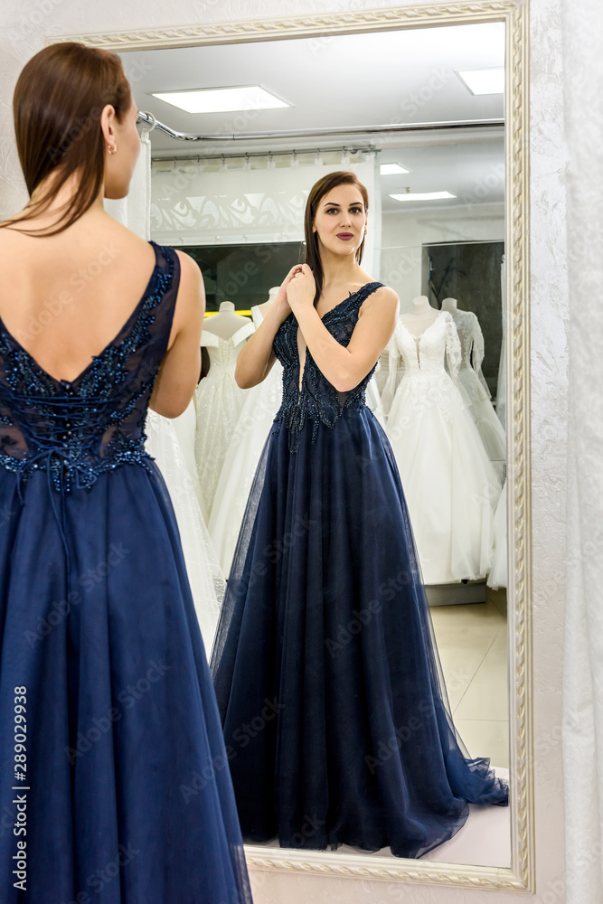 Naklejka premium Fashion model in dark dress, elegant woman in salon