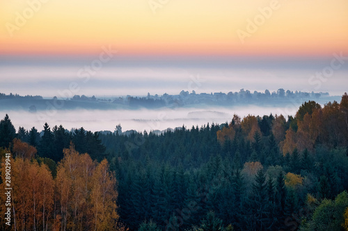 Morning landspace with sun rays. Beautiful landscape with forest and fog.Lithuanian landscape. © Alvydas