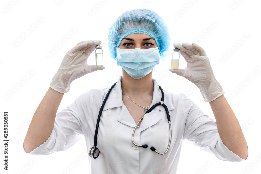 Doctor holding ampoules with medicaments isolated on white Doctor holding ampoules with medicaments isolated on white