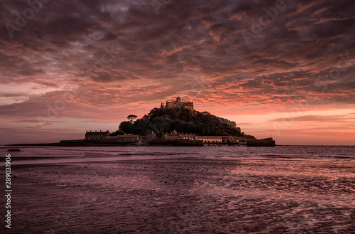 Dramatic sunset on the beach at Marazion with St Michaels Mount, Cornwall England UK Europe