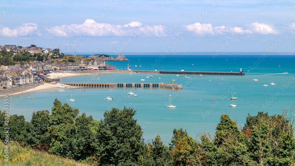 Panoramic view of Cancale in summer day: the city, the beach, ocean with yachts and boats. Brittany region of France.