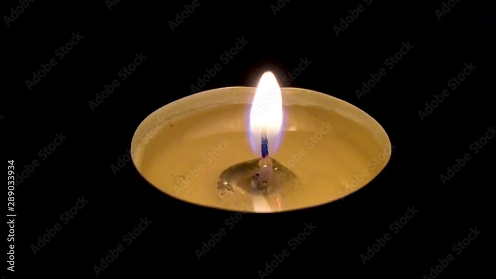 Candle light being blown out in the dark. Candle light being blown out in the dark.