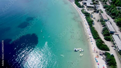 Aerial view of  a long  beach in Pefkohori Halkidiki, Greece, moving forward by drone photo
