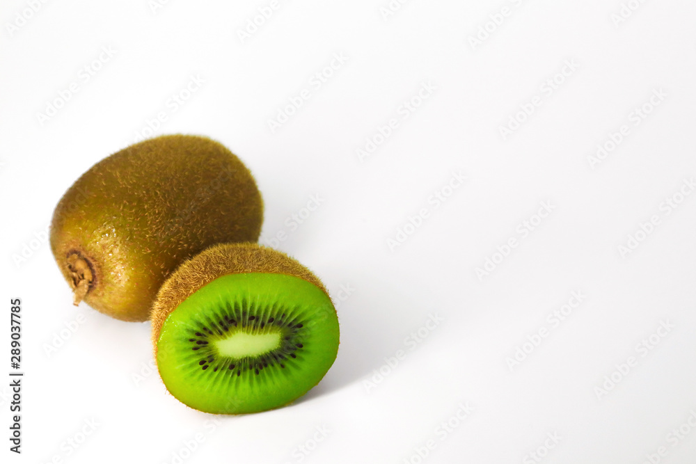 Obraz premium kiwi one pieces and cut half isolated on white background