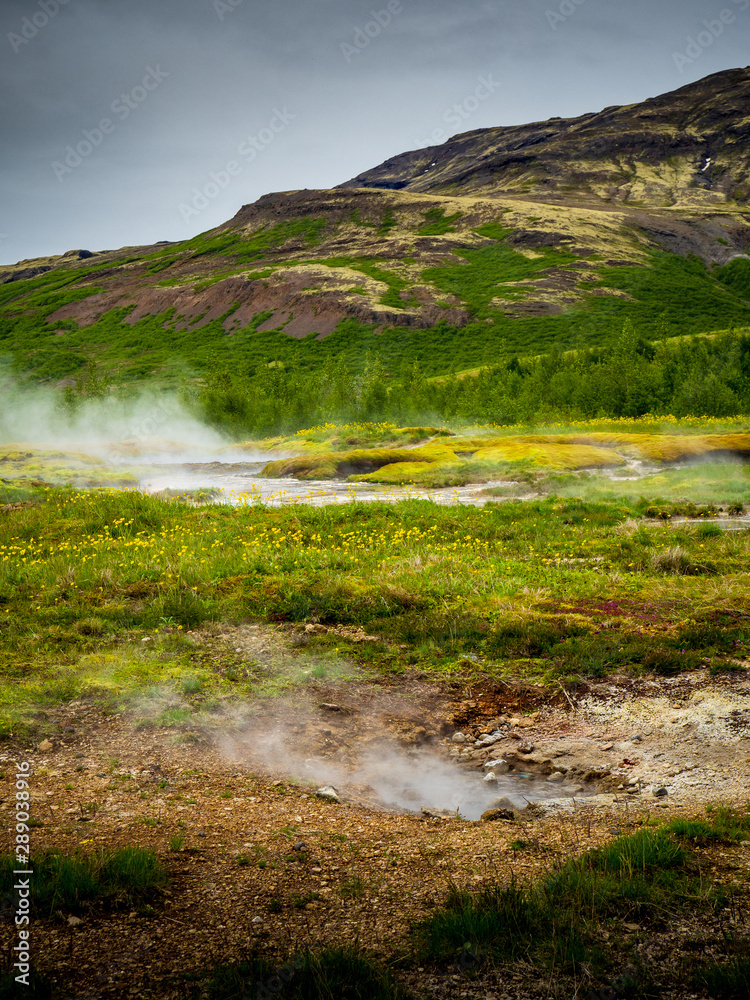 Geysers and steam in Icelandic landscape Geysers and steam in Icelandic landscape