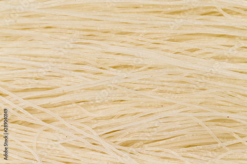 Fototapeta Naklejka Na Ścianę i Meble -  Closeup image of chinese rice glass noodles. Top view asian food background.
