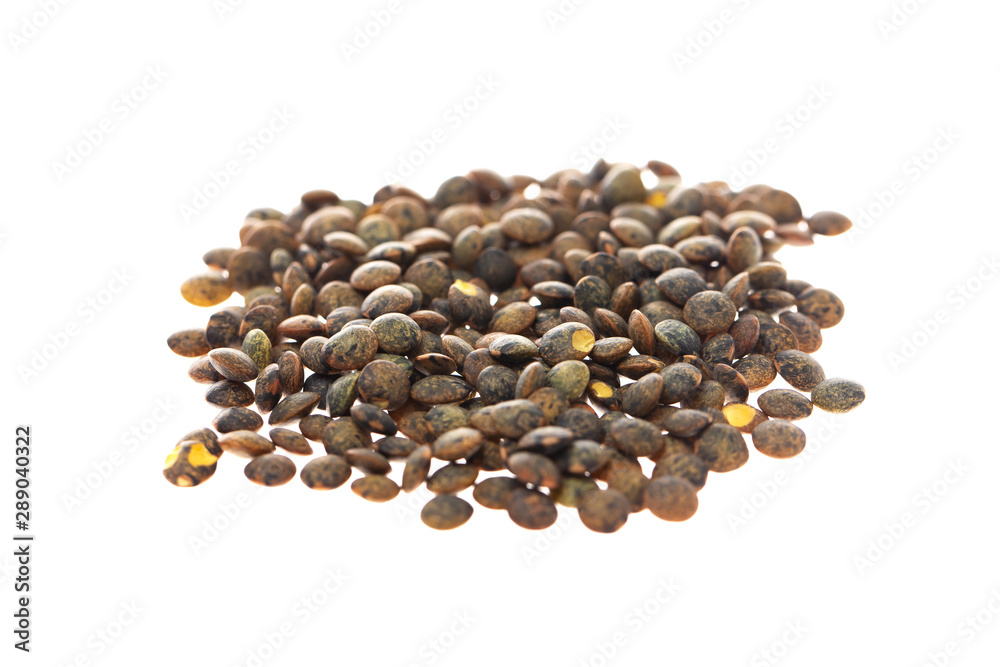 Macro image of brown lentils pile isolated at white background. Macro image of brown lentils pile isolated at white background.