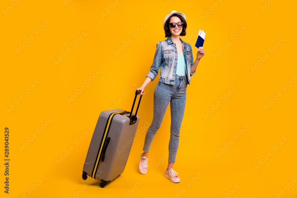 Full length body size photo of cute charming nice glad amazing girlfriend wearing footwear headwear cap with brunette hair ready to get on plane while isolated with vivid background Full length body size photo of cute charming nice glad amazing girlfriend wearing footwear headwear cap with brunette hair ready to get on plane while isolated with vivid background
