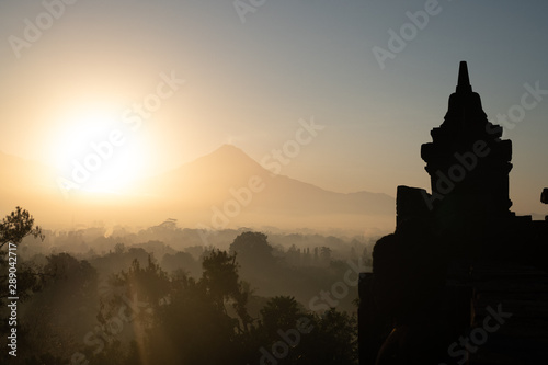 Temple in Indonesia  Indonesian history and culture  historical architecture  volcano landscape  travel  world discoveries  sunrise  sunset
