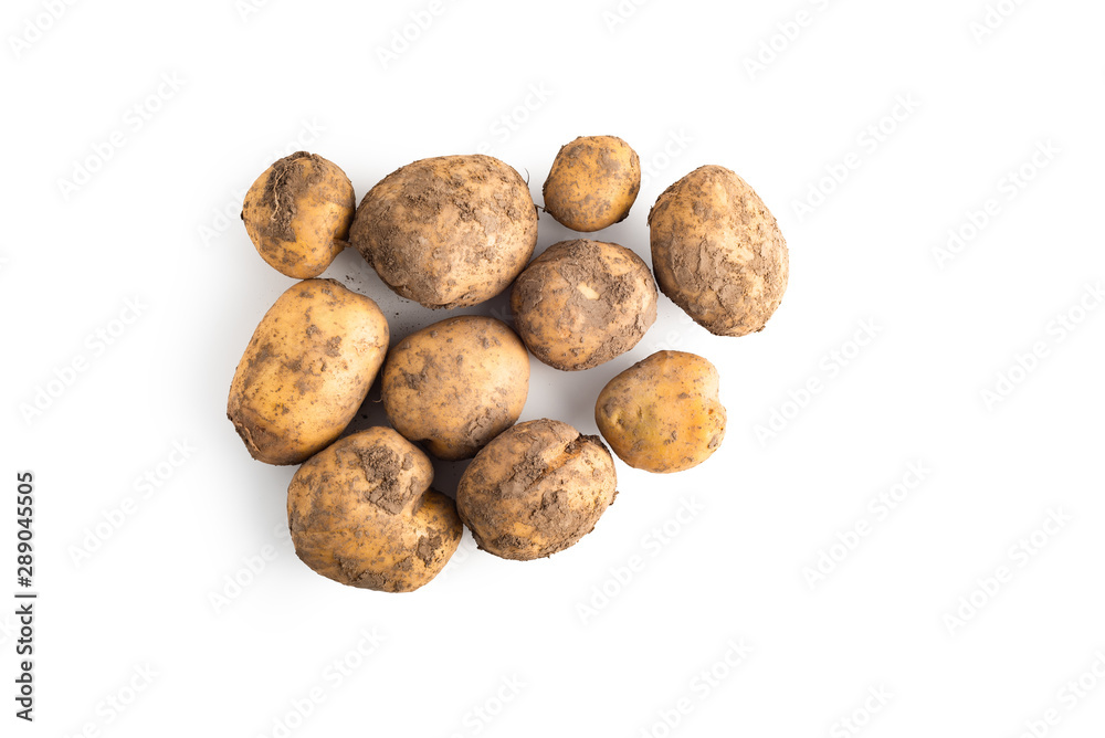 Fresh organic unwashed potatoes isolated over white, top view. Clipping path at 400% Fresh organic unwashed potatoes isolated over white, top view. Clipping path at 400%