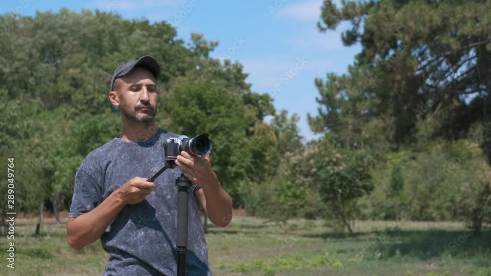 Photographer with a camera on the nature. Photographer with a camera on the nature.