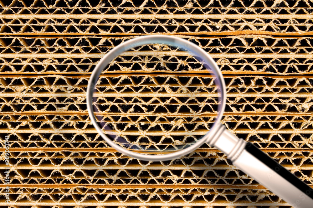 Recycled corrugated cardboard background with overlapping panels - Concept image seen through a magnifying glass - obrazy, fototapety, plakaty 