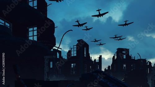 An Armada of military aircraft flies over the ruins of a ruined deserted city. photo