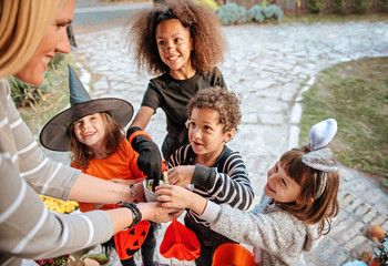 Children in Halloween costumes, trick or treating 