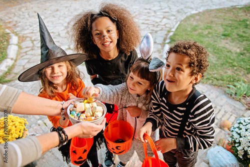 Children in Halloween costumes, trick or treating 