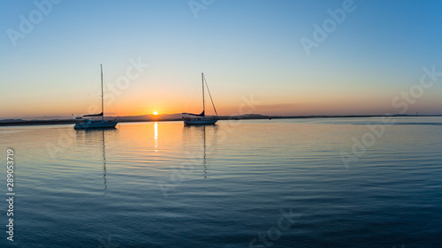 Scenic River Lagoon Estuary Yachts  Silhouetted Calm Water Landscape Sunset © ChrisVanLennepPhoto