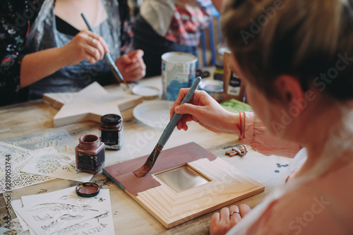 master class on creativity. girl makes a frame photo