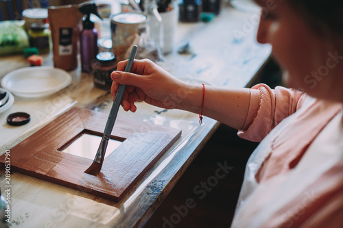 master class on creativity. girl makes a frame