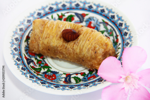 traditional oriental arabic turkish sweet baklava with nuts on a decorative plate