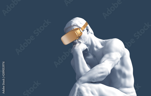 Thinker With Golden VR Glasses Over Blue Background photo