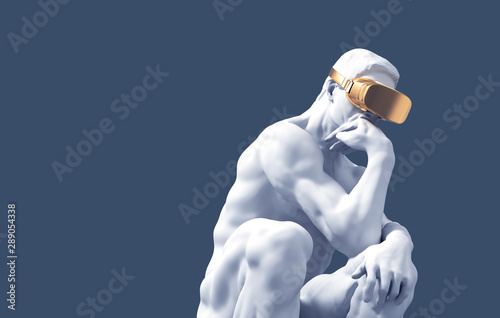 Foto Sculpture Thinker With Golden VR Glasses Over Blue Background