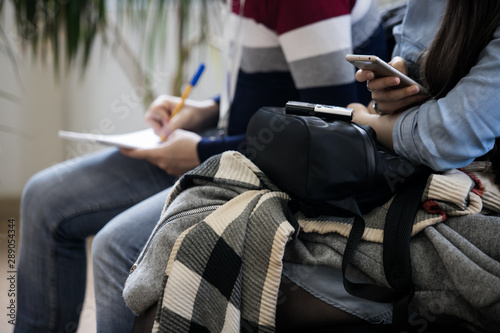 people are sitting on the phone at an event