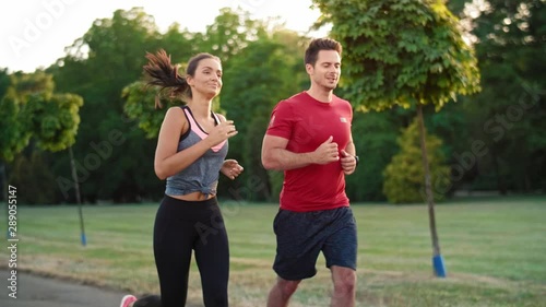 Young couple jogging together in the park