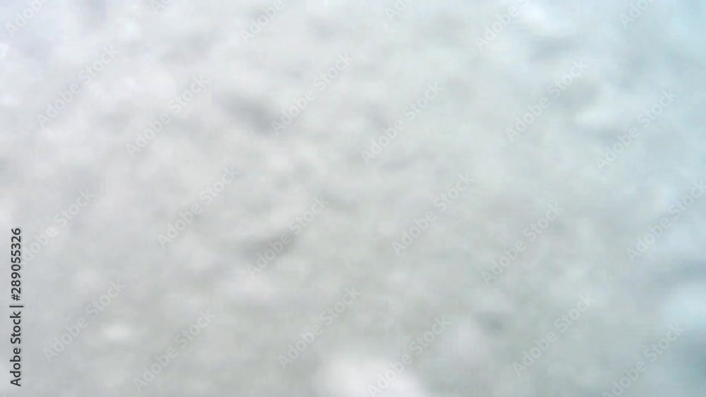 Waves in the sea, a wave covers the camera, under water.