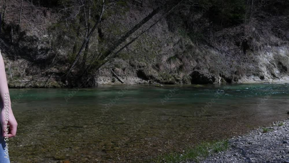 Girl throwing rock in the river, skip rocking, skip rock Girl throwing rock in the river, skip rocking, skip rock