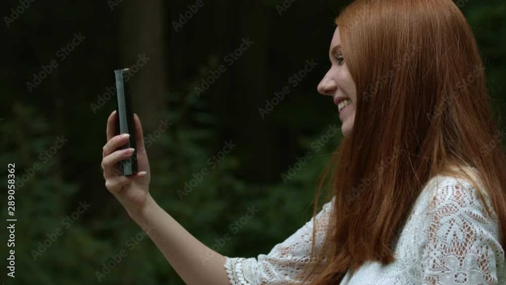 Macro Close Up: Beautiful attractive red haired girl smiles in the camera. Slow Motion