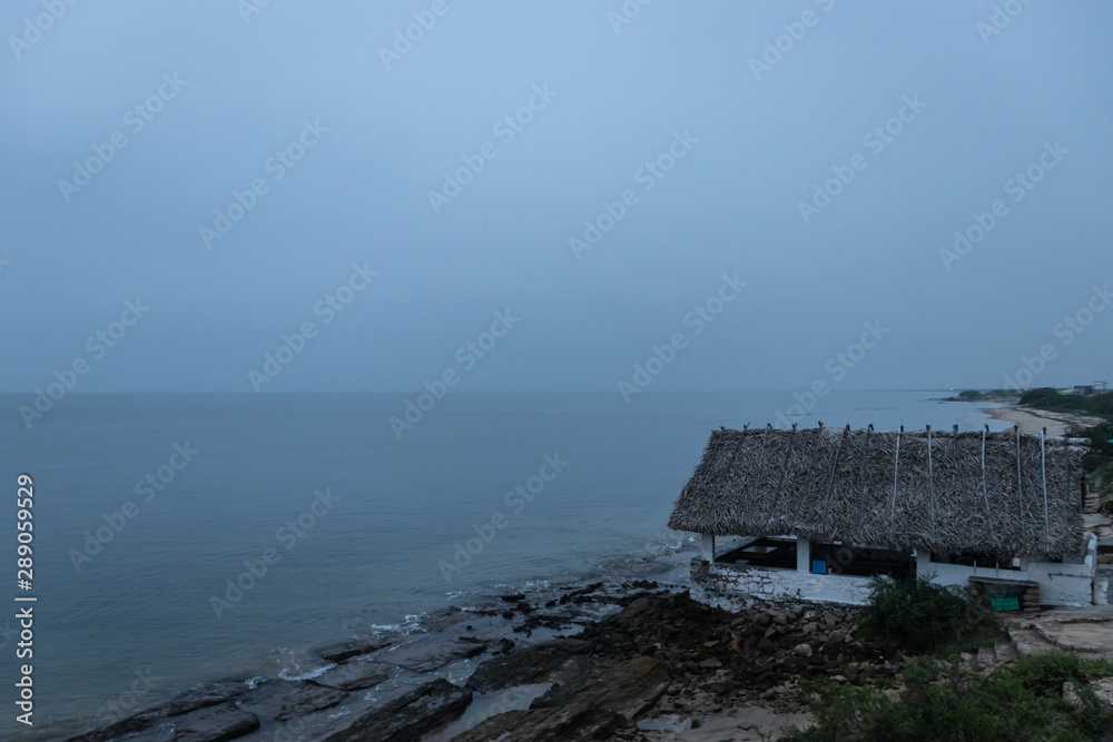 Rustic village home in dawn near sea shore