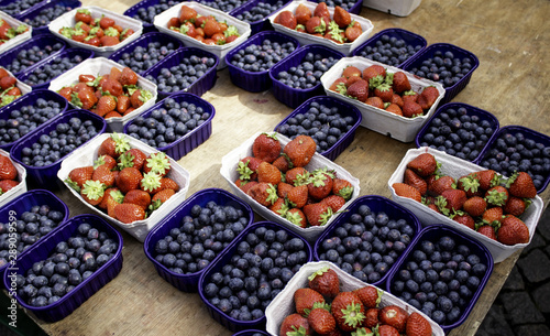 Blueberries and strawberries in market