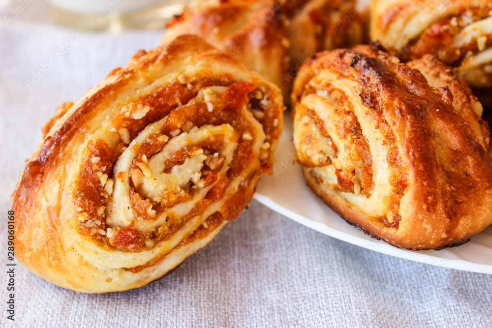 Fototapeta premium Lush buns with dried apricots and walnuts