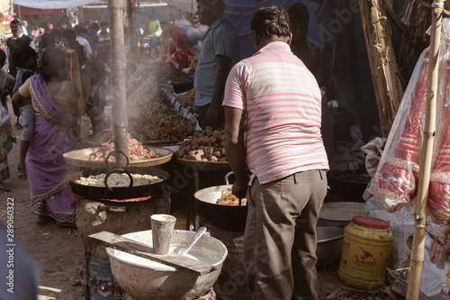 Birbhum district, Bolpur, Shantiniketan, West Bengal, India A sweet food vendor is preparing Mithai during famous Poush Mela or Poush Utsav. Poush Mela is an annual fair and festival takes place.