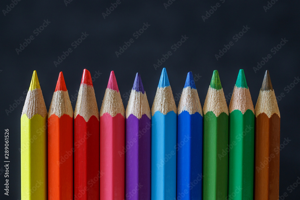 Colored pencils on black background Colored pencils on black background